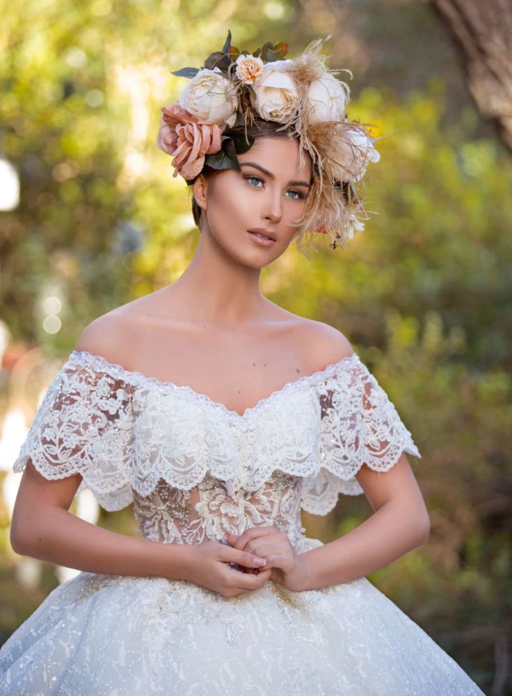 Photo d'une mariée avec une grosse couronne de fleurs pastels.
Formation coiffure 4 jours. Perfectionnement